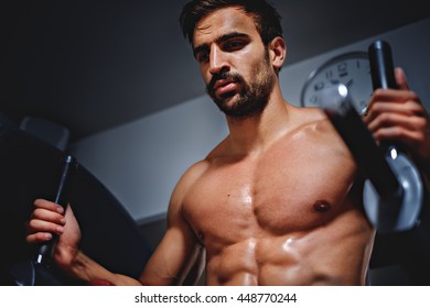 Tired, Sweaty Man In The Gym Looking Down