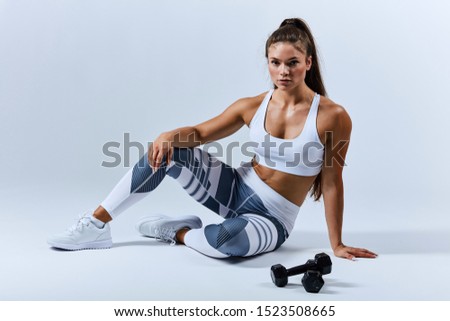 Similar – Image, Stock Photo young woman foam rolling after exercise in gym