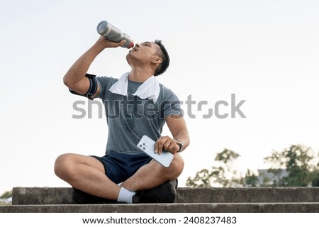 Similar – Image, Stock Photo Young athlete refreshes himself with water after a hard workout on the athletic oval in the intense heat. Endurance training. Brown-haired adolescent