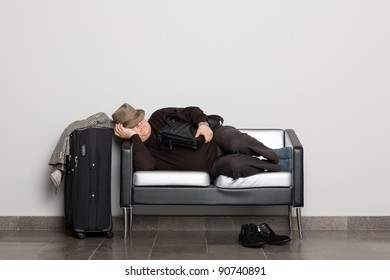 Tired Tourist In Anticipation Of Landing On Aircraft (ferry, Train Or Bus). Flight Delay Due To Weather Conditions. Waiting Hall.