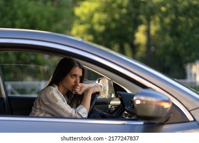 Tired Unhappy Woman In Car Sit On Driver Seat. Exhausted Female Of Middle Age Running Away From Abusing Husband Make Decision Where To Go. Upset Lady Thinking Of Marriage Problems Before Return Home