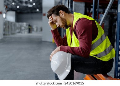 Tired, upset, overworked middle aged worker, man having headache, stress, migraine, standing in warehouse, copy space. Concept of logistics, health care - Powered by Shutterstock