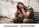 Tired USA navy force patriot guy sit rest old bench protect danger city town street yard wall text space. Worry pain human arm head cry feel upset defeat lost hero god faith religion spirit concept