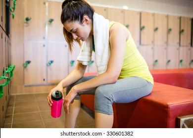 Tired Woman After A Workout In The Gym Locker Room