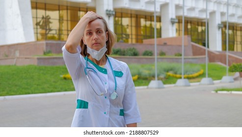 Tired Woman Doctor Walking Near Clinic, Slow Motion Shot