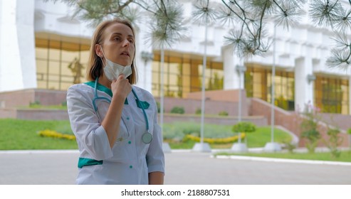 Tired Woman Doctor Walking Near Clinic, Slow Motion Shot