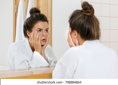 Tired Woman With Eyes Inflammation Is Looking Into The Mirror