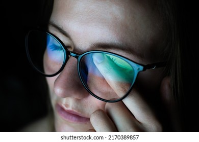 Tired Woman In Glasses Works On Internet. Migraine Or Headache After Work In Front Of Computer All Day. Eye Pain, Dry Eye Syndrome.