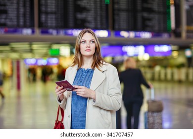 Tired Woman At International Airport Walking Through Terminal. Upset Female Tourist Passenger Waiting. Canceled Flight Due To Pilot Strike.