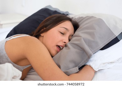 Tired Woman Snoring Loudly In The Bed