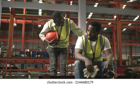 Tired Worker Man Sit In Warehouses Worried Taking Break With Friend From Hard Work Thinking Of Production Problems At Factory, Colleague Encourage, Engineering Working In Heavy Industry Factory