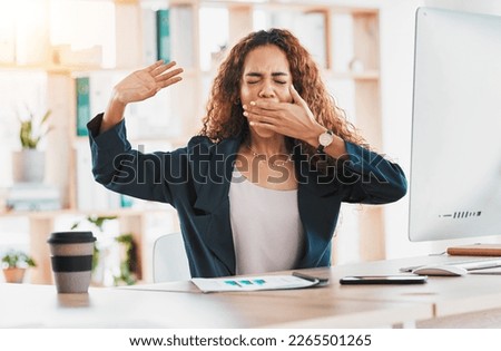 Tired, yawn and business woman at desk in office feeling exhausted, overworked and low energy. Lazy, sleepy and stretching female worker with burnout, fatigue and bored with job in startup company