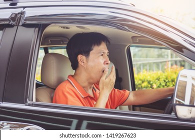 Tired Young Asia Man Driving His Car