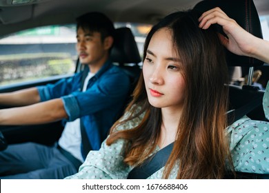 Tired Young Asian Thai Woman Sitting At Passenger Seat. Getting Exhausted From Travel On A Car.