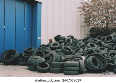 Tires Abandoned in Front of the Tire Dealer. Urban landscape in Milano, Italy. Film Photography - Powered by Shutterstock