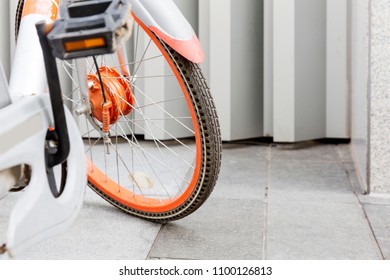 The tires of a shared bicycle