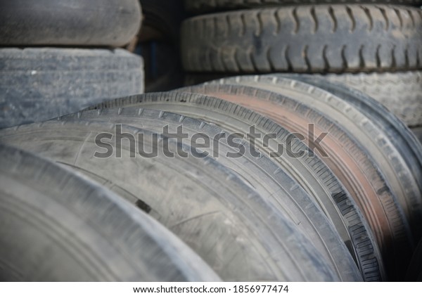 Tires that deteriorate from their use before\
their expiration date. Selective focus. Thailand. Asia. Truck.\
Automotive industry.