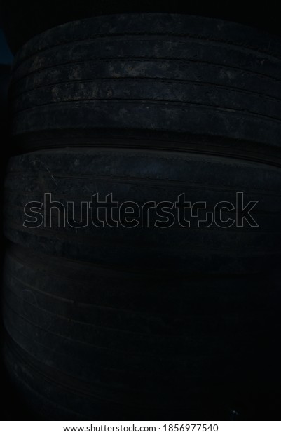 Tires that deteriorate from their use before\
their expiration date. Selective focus. Thailand. Asia. Truck.\
Automotive industry.