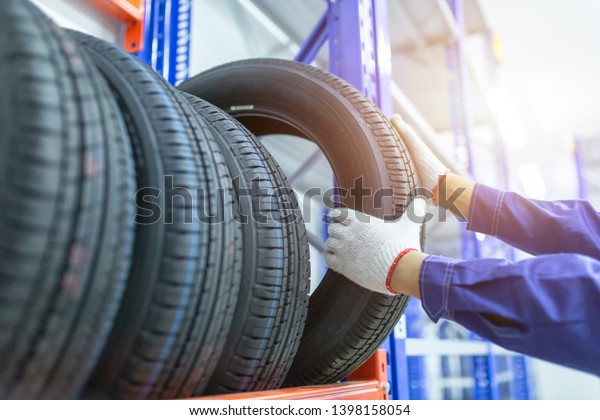 Tires in a tire store, Spare tire car,\
Seasonal tire change, Car maintenance and service center. Vehicle\
tire repair and replacement equipment.\
