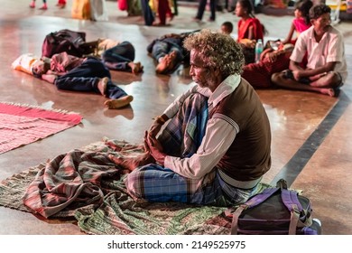 Tirupati, Andhra Pradesh, India - September 2018: An Elderly Indian Male Pilgrim Sitting Alone In The Crowded Waiting Room Of The Venkateshwara Temple In Tirumala.