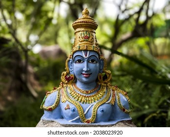 TIRUPATI-ANDHRA PRADESH, INDIA - Jul 12, 2021: close view of Lord Sri Vishnu idol isolated in Natural rock garden in Tirumala: Tirumala, Andhra Pradesh, India-July 10 2021