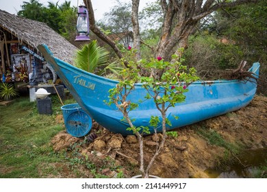 Tissa, Sri Lanka March 15, 2022  A Small Traditonal Boat Sits Outside A Local Farm Market.