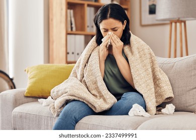 Tissue, blow nose and woman on sofa for home self care with virus, sick and healthcare or allergies. Sinus, flu and person on living room couch with allergy for medical or health and wellness risk