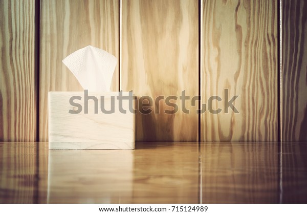 tissue box on wooden\
table