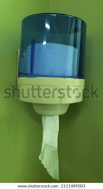 tissue roll dispenser mounted on wall in hospital\
and clinic
