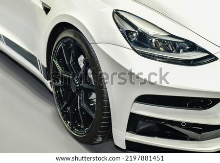 Title: Detail on one of the LED headlights white super car