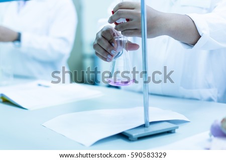 Titration technique in the laboratory.
