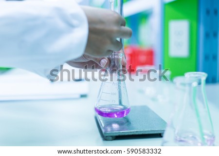 Titration technique in the laboratory.
