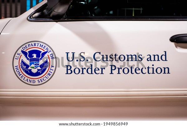 Titusville, FL, USA - Feb. 12,\
2021: Customs and Border patrol logo on the side of the white\
patrol car