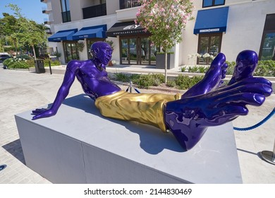 TIVAT, MONTENEGRO - JULY 15, 2021: Sculpture Of A Lying Man With Big Legs, Modern Art Installation