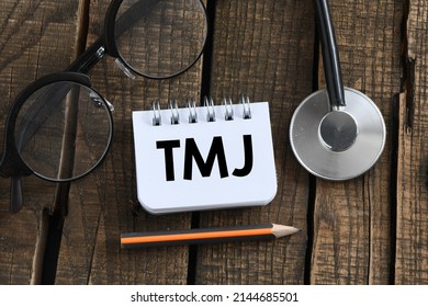 TMJ (Temporomandibular Joints) Words In A Small Office Notebook.