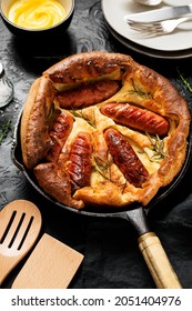 Toad In The Hole, Sausage Toad, Traditional English Dish Of Sausages In Yorkshire Pudding Batter. 