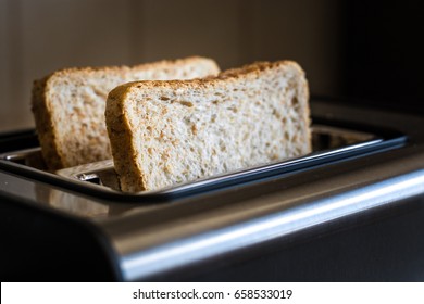 Toast is about to get toasted in toaster close up - Powered by Shutterstock