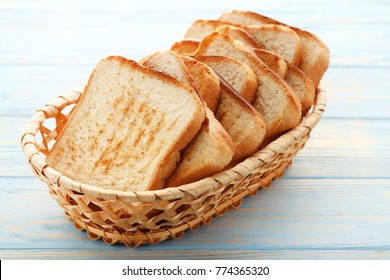 Toast Bread In Basket On Blue Wooden Table