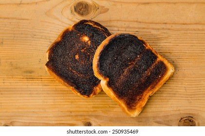 Toast Was Burnt During Toasting. Burnt Toast At Breakfast.