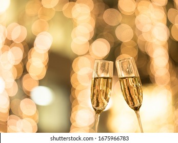 Toast With Champagne Against Illuminations Background.