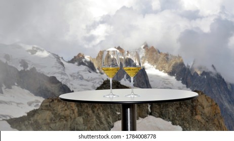 Toast (cheers, Cincin) With Two Glasses Of White Wine Prosecco With The Highest Aperitif In Europe On The Sky Way Terrace Located On The Mont Blanc Glacier. 