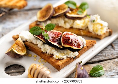 toast with cottage cheese and figs drizzled with honey for breakfast - Powered by Shutterstock