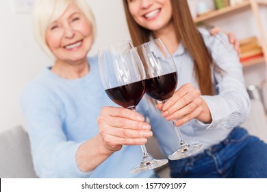 Toast Of Health! Old Mother And Daughter Drinking Wine