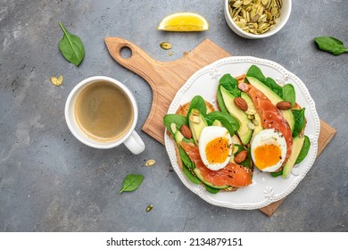Toast salmon, avocado, cheese, egg, spinach, nuts and coffee, Healthy fats, clean eating for weight loss. Ketogenic diet breakfast. banner, menu, recipe place for text, top view.