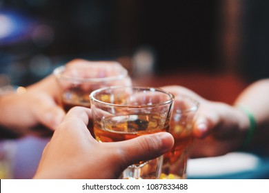 a toast with shots of whiskey