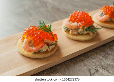 Toast Skagen - Classic Swedish Appetizer. Sandwiches With Shrimps And Caviar On Dark Table. Selective Focus. Gourmet Food.