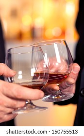 A Toast To Success With A Glass Of Cognac. 