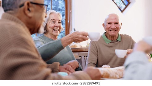 Toast, tea party and a group of elderly people in the living room of a community home for a social. Friends, smile or cheers with happy senior men and women together in an apartment for a visit - Powered by Shutterstock