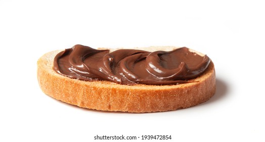 toasted bread with chocolate hazelnut cream isolated on white background, selective focus - Shutterstock ID 1939472854