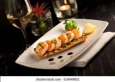 toasted bread foccacia bruschetta with cooked prawn shrimp butter lemon white wine  